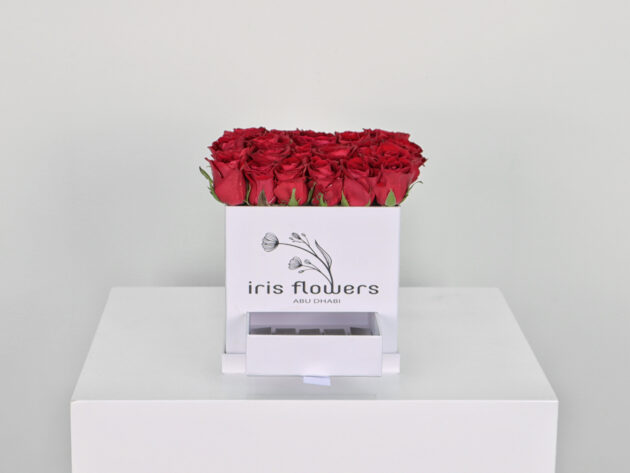 White box red roses with chocolates